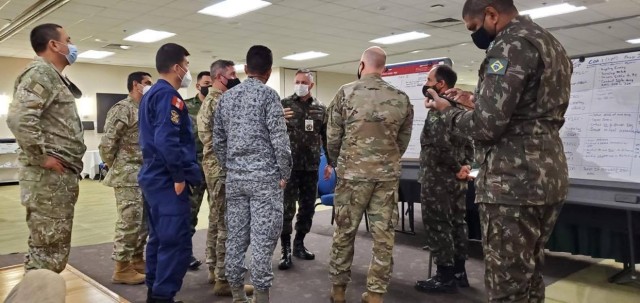 Military officers from Brazil, Colombia and Peru conduct mission analysis as part of the Planning in Crisis exercise Oct. 28 hosted by U.S. Army South and held at Joint Base San Antonio-Fort Sam Houston, Texas, Oct. 26-30. The exercise allowed...