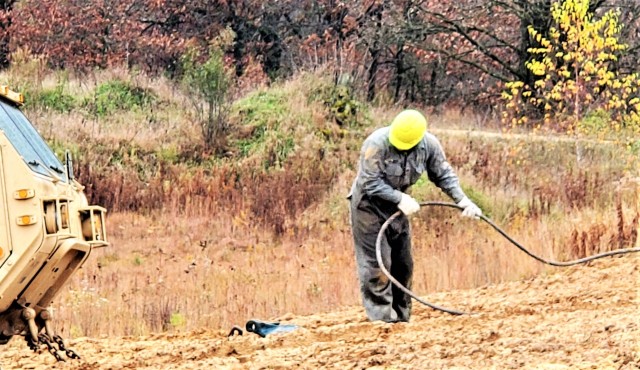 Soldiers at Fort McCoy, Wis., for training in the Regional Training Site-Maintenance Wheeled-Vehicle Recovery Operations Course work together during training Oct. 23, 2020, at the installation Vehicle Recovery Site on North Post. The 17-day course...