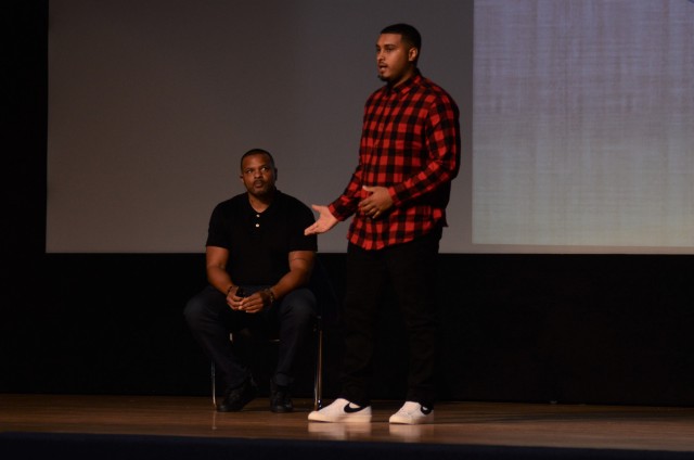 Dante Waltower, motivational speaker and life development coach, speaks during a Domestic Violence Awareness month event Oct. 30 in Carey Theater on Joint Base Lewis-McChord.