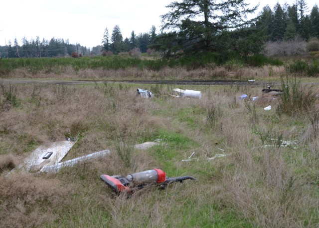 Broken furniture and appliances are illegally dumped in the training areas of Joint Base Lewis-McChord. Since Oct. 26, more than 400 service members have spent over 20,000 man-hours to collect and haul away more than 128 tons, which is 256,000 pounds, of trash from the training areas on base.