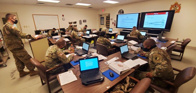 Sgt. Shane Griffin (left) with the Fort McCoy Regional Training Site (RTS)-Maintenance instructor staff, teaches a class Oct. 15, 2020, at Fort McCoy, Wis. The class is part of several courses started as part of the fiscal year 2021 curriculum at...