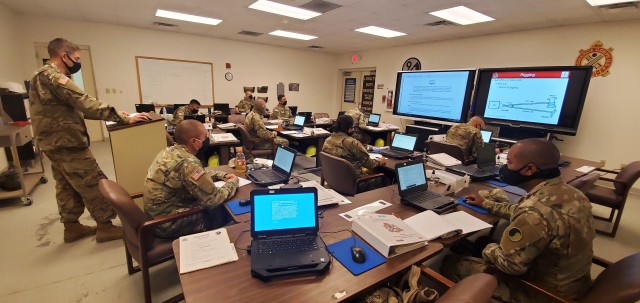 Sgt. Shane Griffin (left) with the Fort McCoy Regional Training Site (RTS)-Maintenance instructor staff, teaches a class Oct. 15, 2020, at Fort McCoy, Wis. The class is part of several courses started as part of the fiscal year 2021 curriculum at...