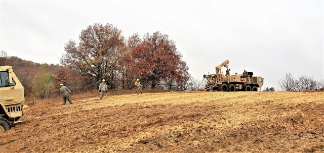 Soldiers at Fort McCoy, Wis., for training in the Regional Training Site-Maintenance Wheeled-Vehicle Recovery Operations Course work together during training Oct. 23, 2020, at the installation Vehicle Recovery Site on North Post. The 17-day course...