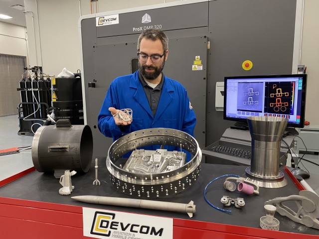 Lance Hall, U.S. Army Combat Capabilities Development Command Aviation & Missile Center additive manufacturing technical lead, demonstrates the capabilities within the center’s new Additive Manufacturing facility. 