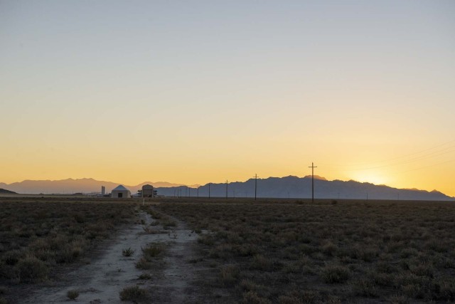 The sun sets on the first Technology Experimentation and Characterization Field Trials (TECFT) held at Dugway Proving Ground. The Active Standoff Chamber (left) and the Joint Ambient Breeze Tunnel (right) can be seen in the distance. Both are...