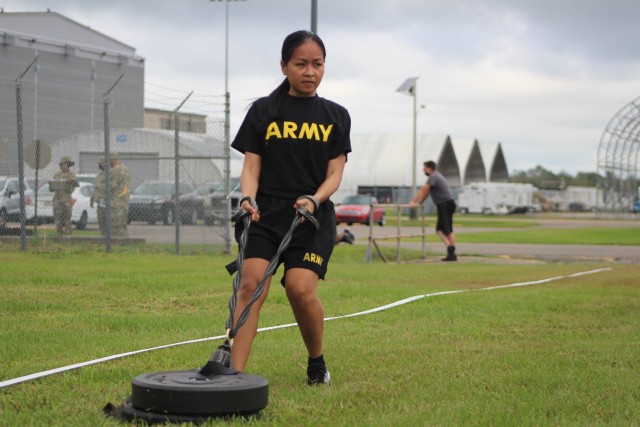 Spc. Ladey Omani, currently serving as a unit supply specialist for the 377th Theater Sustainment Command, pulls a 90-pound weight during training on the Army Combat Fitness Test in Belle Chasse, La. Oct. 25, 2020.  Soldiers took extra COVID safety precautions as they trained on the ACFT during the 377th TSC battle assembly.