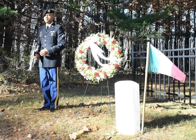 Cpl. Nicholas Smith, a bugler with the 10th Mountain Division Band, plays “Taps” during the wreath-laying ceremony Nov. 4 at the POW (Prisoner of War) Cemetery on Route 26, across from Fort Drum. (Photo by Mike Strasser, Fort Drum Garrison...