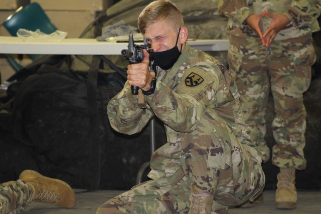 Spc. Brian Hartman, a generator mechanic assigned to the 377th Theater Sustainment Command, aims at a target during primary marksmanship instruction in Belle Chasse, Louisiana, Oct. 25, 2020.  The 377th TSC conducted its first hybrid battle assembly of the new fiscal year with some Soldiers attending in person while others living outside a 50-mile radius receiving training online. The command is using a combination of virtual and in-person training to increase safety in a COVID environment.