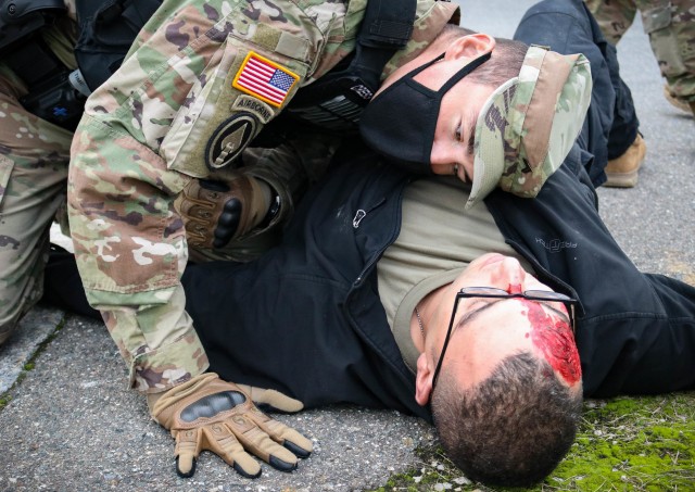 Cpl. John-Michael Cress, a military police Soldier with the 29th Military Police Company, Maryland Army National Guard, checks for breathing on a mock patient during a mass casualty training event at the Joint Multinational Readiness Training...