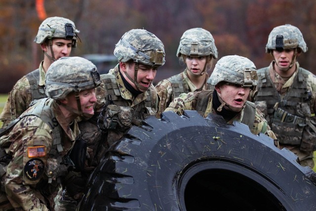 Cadets from the Company H-4 team try to flip a tire during the Team Challenge Event Friday at the Fall Sandhurst Competition. The Team Challenge Event includes the tire flips, a High Mobility Multipurpose Wheeled Vehicle (HMMWV) push/pull and...