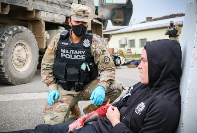 Spc. Brianna Nolen, a military police Soldier with the 29th Military Police Company, Maryland Army National Guard, assesses a patient during a mass casualty training event at the Joint Multinational Readiness Training Center in Hohenfels, Germany,...