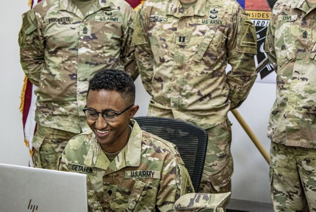 Spc. Natnael M. Getahun, an infantryman assigned to 1st Armored Division’s Headquarters and Headquarters Company Brigade, 40th Brigade Engineering Battalion, 2nd Armored Brigade Combat Team out of Fort Bliss, Texas, receives his acceptance to the University of Chicago during a surprise video conference with the dean of admissions Oct. 26, 2020, while deployed to Kuwait for Operation Spartan Shield.