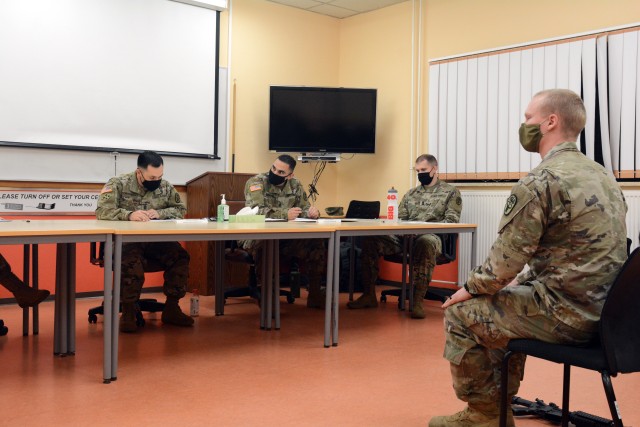 1st Lt. Jacob Schwanz (right), assigned to U.S. Army Medical Department Activity-Bavaria, competes in the oral board portion of the Regional Health Command Europe Best Warrior competition Nov. 3 and 4 in Baumholder.  Schwanz was the winner in the...