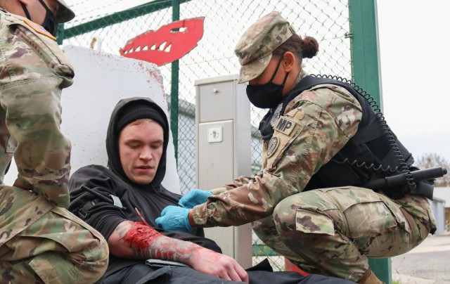 Spc. Brianna Nolen, a military police Soldier with the 29th Military Police Company, Maryland Army National Guard, assesses a patient during a mass casualty training event at the Joint Multinational Readiness Training Center in Hohenfels, Germany,...