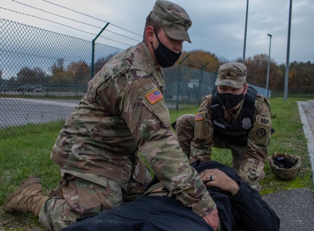 Spc. Garrett Moats, (right) a combat medic specialist with 566th Area Support Medical Company, 61st Medical Battalion  and Sgt. Josh Wilkinson (left), a military police Soldier with the 29th Military Police Company, Maryland Army National Guard, responds to a simulated mass casualty incident during a Joint Multinational Readiness Center exercise rotation in Hohenfels, Germany, on Nov. 4, 2020. The 29th MP Company is completing a rotation at the Joint Multinational Readiness Center, where the Soldiers are receiving realistic training to prepare them for their upcoming deployment to Kosovo. (U.S. Army National Guard photo by Sgt. Zachary M. Zippe)