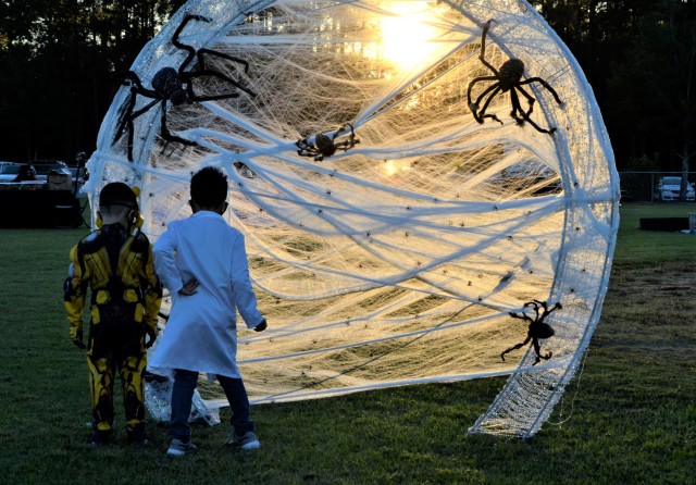Ian and Ethan Aguiar look through a spider web prop for a prize during the 2020 Fall Festival, Oct 30. Outdoor Recreation dedicated multiple hours to ensure
...