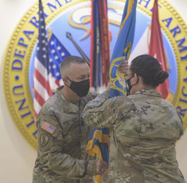 Command Sgt. Maj. Brian T. Bertazon incoming Command Sergeant Major, Military Intelligence Readiness Command (MIRC), receives the command colors from Brig. Gen. Aida T. Borras, Commanding General, Military Intelligence Readiness Command during a change of responsibility ceremony at Fort Bragg, North Carolina, September 11, 2020. Key guests included, Borras, Maj. Gen. A.C. Roper, Deputy Commanding General U.S. Army Reserve Command, Brig. Gen. Robert S. Cooley Jr., Army Reserve Command Chief of Staff and Chief Warrant Officer 5 Harold (Hal) Griffin III, Command Chief Warrant Officer, U.S. Army Reserve Command (U.S. Army Reserve photo by Staff Sgt. Edgar Valdez)