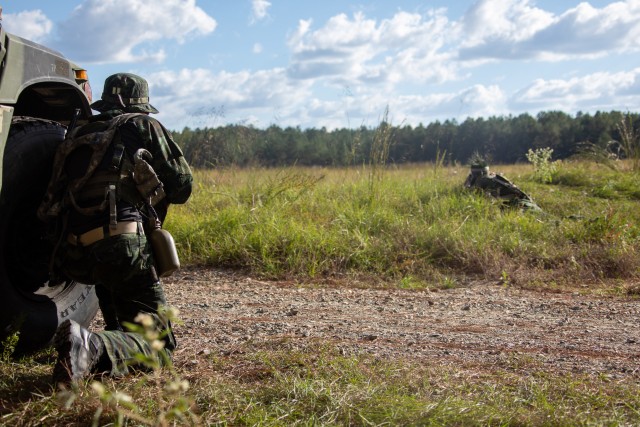 FORT POLK, La. -- A special operations forces soldier assigned to the Royal Thai Army’s 1st Special Forces Regiment and a Green Beret with 1st Special Forces Group (Airborne) scan for opposition forces during a training mission at Fort Polk, Louisiana, Oct. 17, 2020. U.S. and Thai SOF trained together from October 14-27 during the Joint Readiness Training Center (JRTC) rotation 21-01 to enhance both tactical knowledge and partnership. (U.S. Army photo by Pfc. GaoZong Lee)