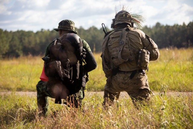 (Photo altered for security purposes)
FORT POLK, La. -- A Green Beret assigned to 1st Special Forces Group (Airborne) and a special operations forces soldier assigned to the Royal Thai Army’s 1st Special Forces Regiment scan for opposition forces during a training mission at Fort Polk, Louisiana, Oct. 21, 2020. U.S. and Thai SOF conducted operations together from October 14-27 during the Joint Readiness Training Center (JRTC) rotation 21-01 to enhance both tactical knowledge and partnership. (U.S. Army photo by Pfc. GaoZong Lee)(Photo altered for security purposes)