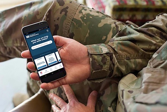 A Soldier uses the Military OneSource app on his cellphone.
