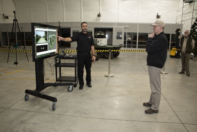 U.S. Army Engineer Research and Development Center (ERDC), Construction Engineering Research Laboratory (CERL), systems engineer and Robotics for Engineer Operations (REO) project lead, Dr. Ahmet Soylemezoglu, briefs the Principal Deputy Assistant...