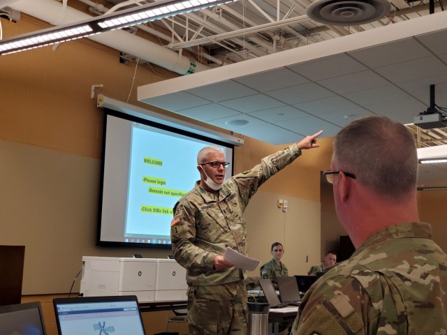 Command Sgt. Maj. Steve Harmon, senior enlisted advisor of the Kansas Army National Guard, briefs on how to evaluate promotable Soldiers during an Enlisted Promotion System board held at the Heartland Preparedness Center in Wichita, Kansas, Oct....