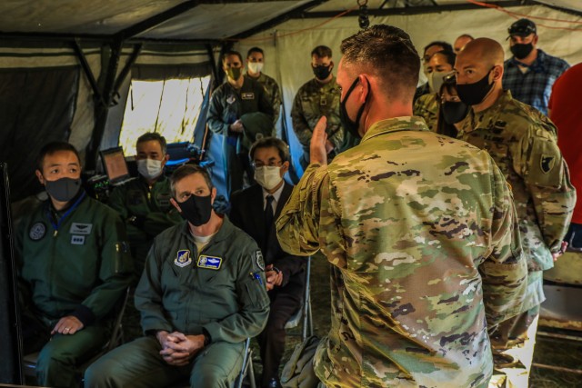 Capt. Stephen D. Murphy, commander, Battery A, 1st Battalion, 1st Air Defense Artillery Regiment, briefs U.S. Air Force Lt. Gen. Kevin B. Schneider, commander, U.S. Forces Japan and 5th Air Force, and Japan Air Self-Defense Force Lt. Gen. Hiroaki...