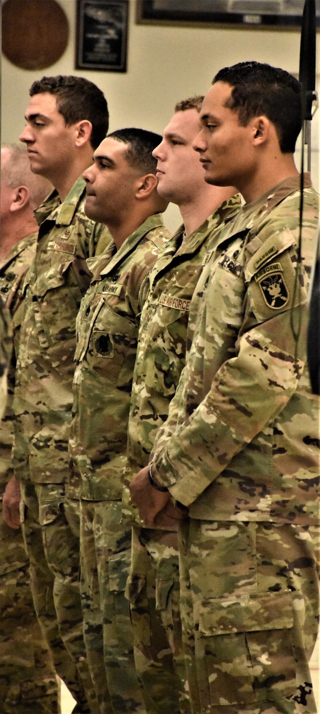 Staff Sgt. Jordan Alston (center), recruiter, Yuma Recruiting Station, Phoenix West Recruiting Company, stands in formation as he prepares to graduate the Military Freefall School Parachutist Course, Yuma Proving Ground, Yuma, Ariz., Oct. 30. Alston’s attendance was a rare opportunity for a recruiter to attend the school, mainly reserved for special operations groups such as Army Special Forces and Rangers, Navy Seals, and Air Force Para-Rescue and Combat Controllers. (U.S. Army Photo by Alun Thomas, USAREC Public Affairs)