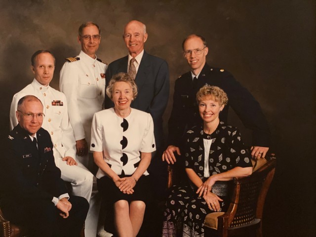 The Gervais family pose for a photograph, some of them in their military uniform.