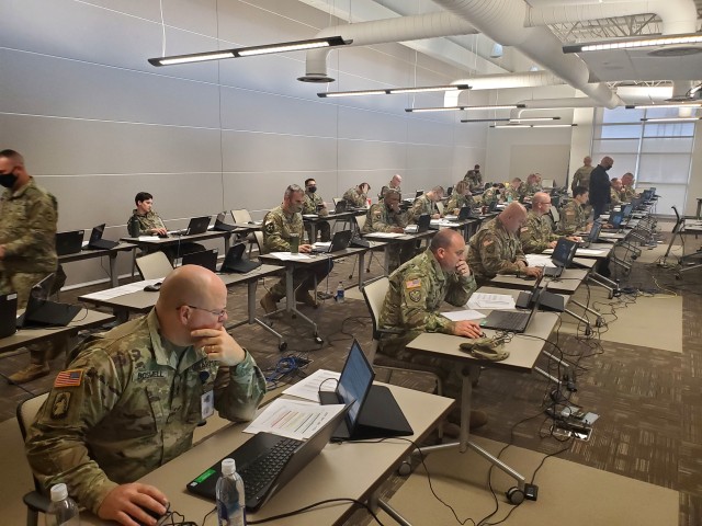Kansas Army National Guard noncommissioned officers evaluate records to identify which Soldiers will be promoted during an Enlisted Promotion System board held at the Heartland Preparedness Center in Wichita, Kansas, Oct. 23-25, 2020.