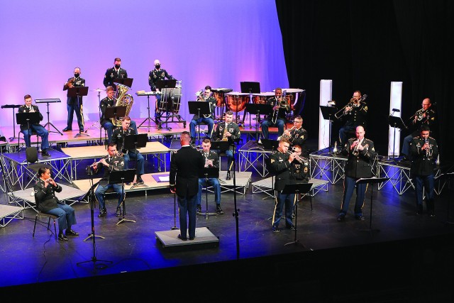 Warrant Officer Richard Townes directs the 77th Army Band during a recording session at McMahon Memorial Auditorium Nov. 5, in Lawton. The band also recorded music selections Nov. 4, which were then assembled for the band’s first-ever virtual...