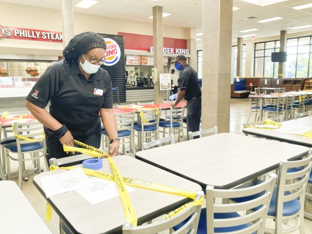 Stephanie Steele, overhead supervisor of the Fort Campbell Exchange food court, taped off ta-bles to enforce social distancing between guests dining in the lobby.
COVID complacency