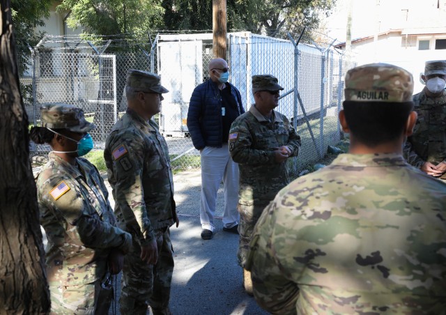 MIHAIL KOGALNICEANU, ROMANIA -- Staff Sgt. Breanna Gray, Non-Commissioned Officer in Charge, Troop Medical Clinic, and her boss, Col. Jeffrey A. Wade, Director of Health Services, for Mihail Kogalniceanu, Romania and Novo Selo Training Area,...