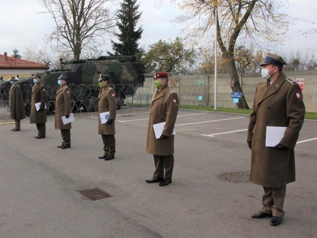 Polish Soldiers assigned to Headquarters, Multinational Division-North East participate in a small ceremony on Nov. 10 in Elblag, Poland, in honor of Poland's Independence Day which would occur the following day on Nov. 11.
