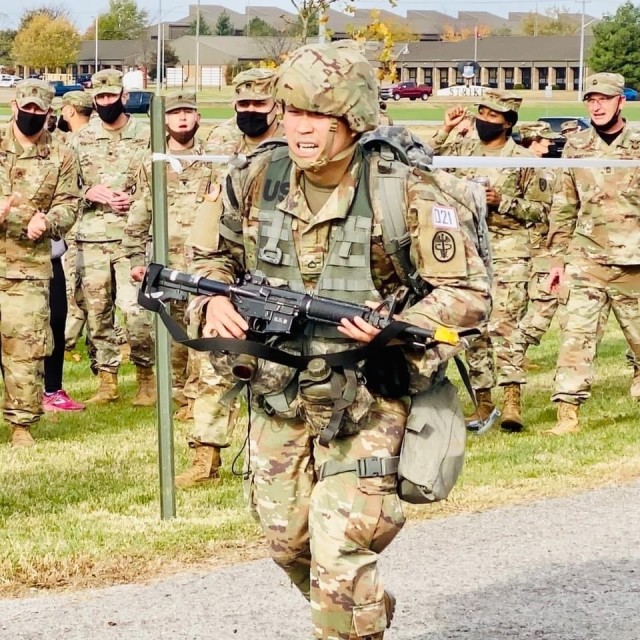 Finishing this morning's 12-mile ruck march, Pfc. Sangoh Choi, a behavioral health specialist assigned to Blanchfield Army Community Hospital, completed a grueling 14-day qualification period to earn the coveted Expert Field Medical Badge. EFMB is...