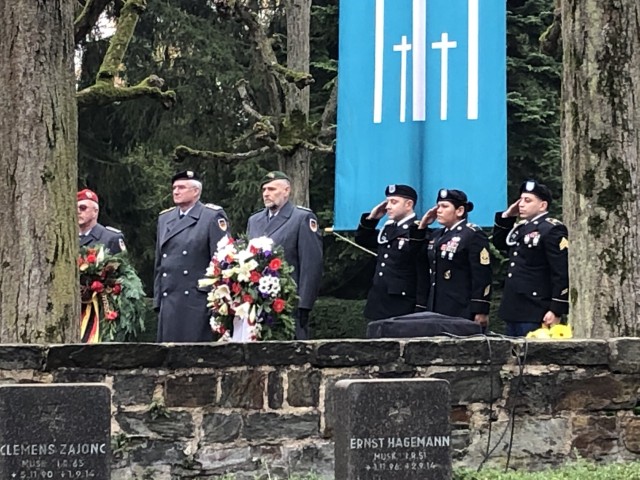 WIESBADEN, Germany – 1st Sgt. Lori Soto (second from the right), along with two Soldiers, attend the National Day of Mourning ceremony at the Wiesbaden South cemetery Nov. 17, 2019.
(Photo by Liz Moore)