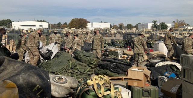 Soldiers with the 526th Brigade Support Battalion, 2nd Brigade Combat Team, 101st Airborne Division (Air Assault) go through items pulled out of their storage containers Nov. 5 to see what needs to be kept, thrown away or recycled as part of...