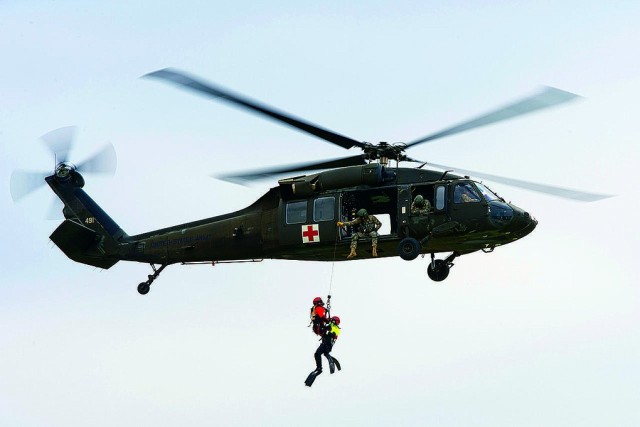 An Oklahoma Army National Guard UH-60 “Black Hawk” helicopter and crew conduct water rescue training over the Oklahoma River in Oklahoma City on Thursday, April 5. Members of the Oklahoma City, Norman, Verdigris and Tulsa Fire Department...