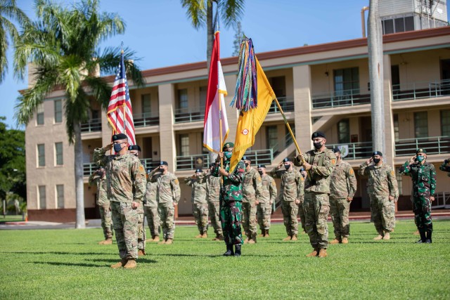 Soldiers assigned to 3rd Squadron, 4th Cavalry Regiment, 3rd Infantry Brigade Combat Team, 25th Infantry Division and Soldiers assigned to the Indonesian Army's 431st Para Raider Infantry Battalion render hand salutes during the playing of the national anthems of the United States and Indonesia during the opening ceremony of the U.S. hosted portion of the 2020 Indonesia Platoon Exchange at Schofield Barracks, Hawaii on Nov. 14, 2020. Throughout the next two weeks, Soldier from both armies will train alongside one another sharing their expertise in tactics to include counter-improvised explosive device training, Military Operations in Urban Terrain (MOUT) training and survival training at the 25th Infantry Division's Lightning Academy. (U.S. Army photo by Staff Sgt. Alan Brutus)