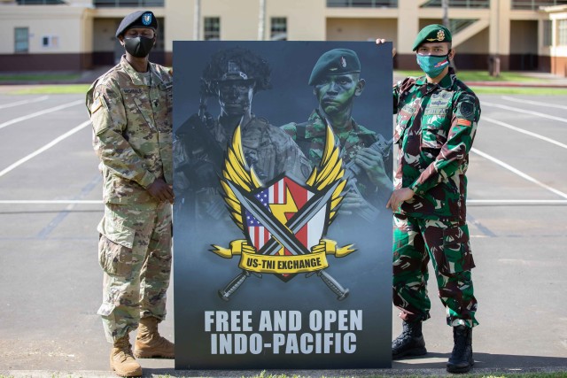 Soldiers assigned to 3rd Squadron, 4th Cavalry Regiment, 3rd Infantry Brigade Combat Team, 25th Infantry Division and the Indonesian Army's 431st Para Raider Infantry Battalion pose together during the opening ceremony of the U.S. hosted portion of the 2020 Indonesia Platoon Exchange at Schofield Barracks, Hawaii on Nov. 14, 2020. Throughout the next two weeks, Soldier from both armies will train alongside one another sharing their expertise in tactics to include counter-improvised explosive device training, Military Operations in Urban Terrain (MOUT) training and survival training at the 25th Infantry Division's Lightning Academy. (U.S. Army photo by Staff Sgt. Alan Brutus)