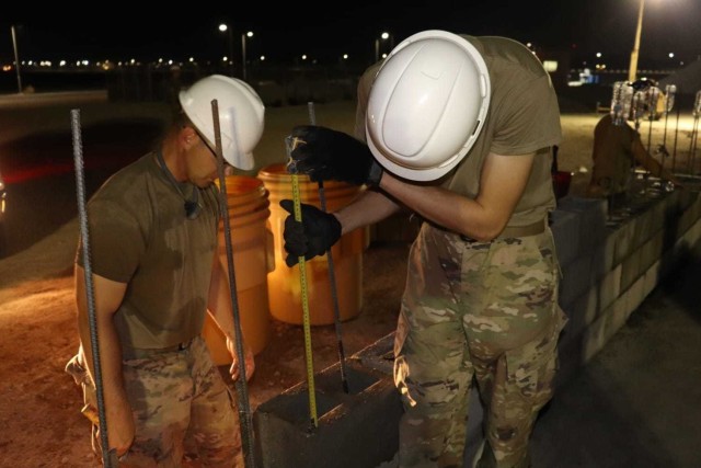 Members of the 310th Engineering Detachment work on construction a Joint Air Ground Station building in Qatar. The building is being built using troop labor from a design from the U.S. Army Corps of Engineers Middle East District&#39;s Center of...
