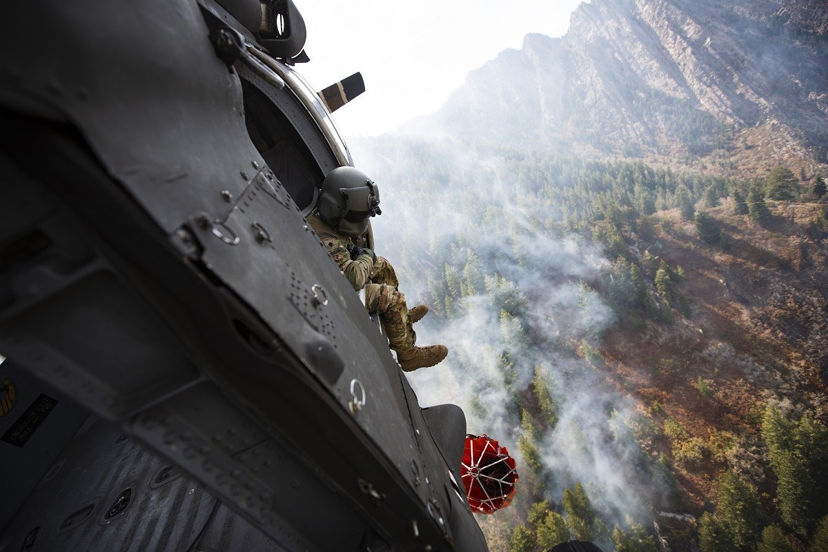 Crew members of the 211th Aviation Regiment conduct air support over the Neffs Canyon fire from a UH-60 Blackhawk helicopter in Salt Lake City, Utah, Sept. 20, 2020.