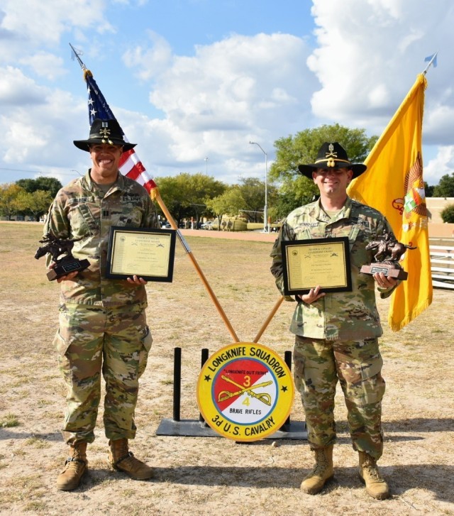 Cpt. Caleb Bloom and 1st Sgt. Samuel Winkler from Nomad Troop, 4th Squadron, 3rd Calvary Regiment, are awarded the Armor and Calvary Leadership award for having a disciplined, fit, and cohesive unit on November 6 at Fort Hood, Texas. (U.S. Army photo by Maj. Marion Jo Nederhoed, 3rd Calvary Regiment Public Affairs)