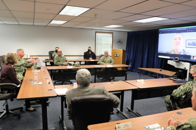 Assistant Secretary of the Navy (Manpower and Reserve Affairs) Catherine Kessmeier and Vice Adm. John Nowell, Jr., Chief of Naval Personnel (CNP), participate in a socially distanced meeting with Fort McCoy Deputy to the Garrison Commander Brad Stewart and Command Sgt. Maj. Paul Mantha, garrison command sergeant major, on Oct. 27, 2020, at the garrison headquarters building at Fort McCoy, Wis. Garrison Commander Col. Michael D. Poss dialed in virtually from a temporary duty location. The Navy leadership team visited Fort McCoy to meet with Navy cadre personnel who are working with new recruits at Fort McCoy before they attend boot camp at Recruit Training Command in Great Lakes, Ill. They stopped by to thank Fort McCoy staff for their continued support of this unique and critical Navy mission. Joining the assistant secretary and the CNP were Rear Adm. Peter Garvin, Commander of Naval Education and Training Command, Rear Adm. Jamie Sands, commander of Naval Service Training Command, and Master Chief Petty Offi