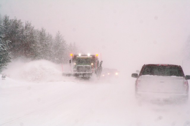 A snowplow truck pushes snow during a snowstorm Feb. 12, 2019, on Wisconsin State Highway 21 at Fort McCoy, Wis. Fort McCoy's Installation Safety Office reminds all drivers to have their vehicles and driving skills ready for winter driving. (U.S....