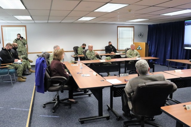 Assistant Secretary of the Navy (Manpower and Reserve Affairs) Catherine Kessmeier and Vice Adm. John Nowell, Jr., Chief of Naval Personnel (CNP), participate in a socially distanced meeting with Fort McCoy Deputy to the Garrison Commander Brad Stewart and Command Sgt. Maj. Paul Mantha, garrison command sergeant major, on Oct. 27, 2020, at the garrison headquarters building at Fort McCoy, Wis. Garrison Commander Col. Michael D. Poss dialed in virtually from a temporary duty location. The Navy leadership team visited Fort McCoy to meet with Navy cadre personnel who are working with new recruits at Fort McCoy before they attend boot camp at Recruit Training Command in Great Lakes, Ill. They stopped by to thank Fort McCoy staff for their continued support of this unique and critical Navy mission. Joining the assistant secretary and the CNP were Rear Adm. Peter Garvin, Commander of Naval Education and Training Command, Rear Adm. Jamie Sands, commander of Naval Service Training Command, and Master Chief Petty Offi