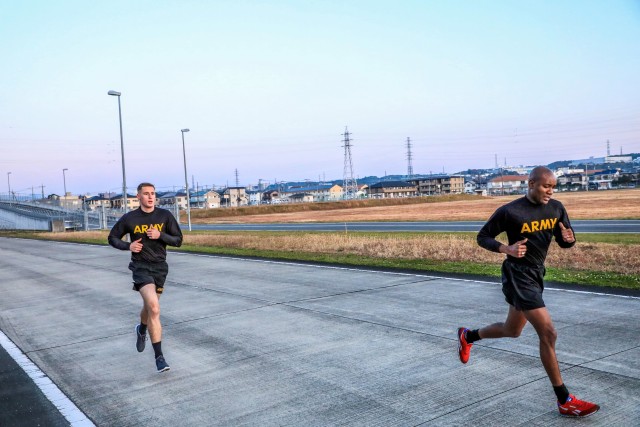SAGAMIHARA, Japan – Sgt. Robert W. Redmond (left), military police, 14th Missile Defense Battery, and Sgt. Derrick D. Avent (right), automated logistical specialist with Headquarters and Headquarters Battery, 38th Air Defense Artillery Brigade completes the two-mile run portion of the Army Combat Fitness Test assessment during the Pacific Guardian of the Quarter Competition at Sagami General Depot, Nov. 16. Eight Soldiers and noncommissioned officers assigned to various units throughout 38th ADA Brigade competed in a grueling test of their physical and mental abilities during a quarterly contest Nov. 16-17.