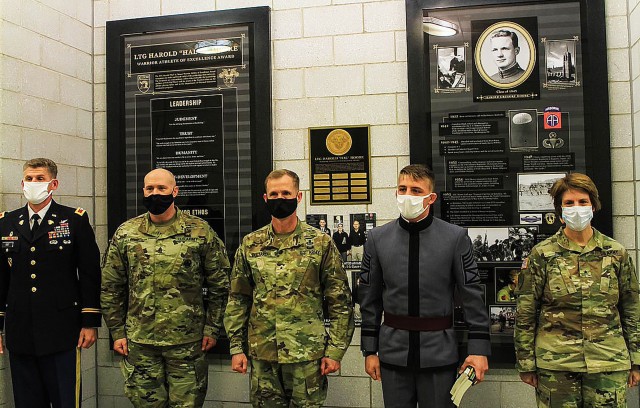 Class of 2021 Cadets Beaux Guffey (second from right) and Gabrielle White (not shown) are recognized by the Department of Physical Education Director Col. Nicholas Gist, U.S. Corps of Cadets command sergeant major Command Sgt. Maj. Kenneth Killingsworth, U.S. Corps of Cadets Commandant Brig. Gen. Curtis A. Buzzard and Dean of the Academic Board Cindy R. Jebb during the ninth annual Lt. Gen. Hal Moore Warrior Athlete of Excellence Award ceremony Nov. 12 at Arvin Cadet Physical Development Center. The Department of Physical Education recognized the two cadets for living by the tenets of the warrior ethos.  