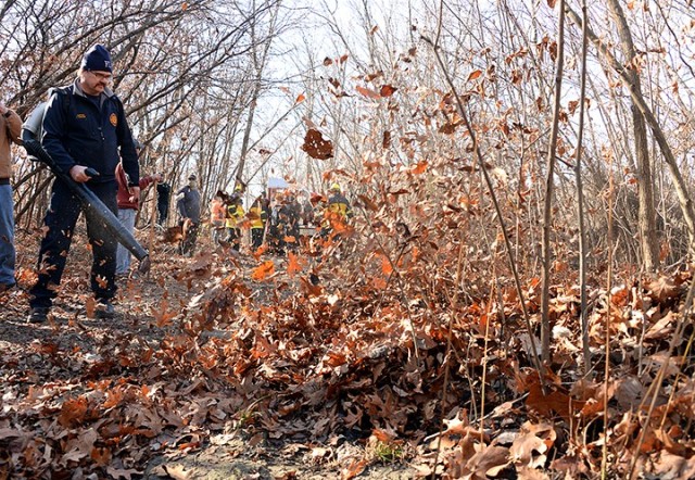 Fort Leavenworth Fire and Emergency Services Capt. Trent Strayer uses a leaf blower to help outline the burn area before beginning a small prescribed burn Nov. 17 along a multi-use trail near Sheridan Drive. Fort Leavenworth Fire Department and...