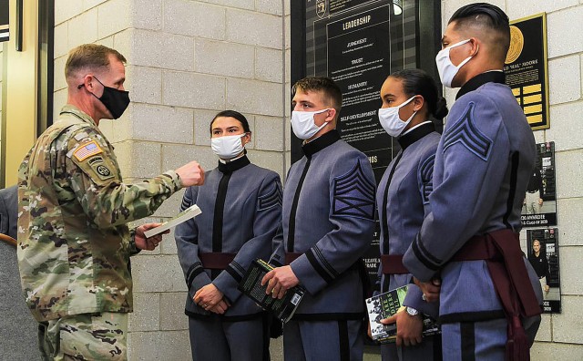 (From left to right) Class of 2021 Cadets Morgan Walsh, Beaux Guffey, Gabrielle White and Jacob Bueno (Right) listen intently as U.S. Corps of Cadets Commandant Brig. Gen. Curtis A. Buzzard imparted words of wisdom to the awardees and runners-up explaining the importance of the award and Moore’s book, ‘We Were Soldiers Once ... and Young: Ia Drang - the Battle That Changed the War in Vietnam’ during the ninth annual Lt.  Gen. Hal Moore Warrior Athlete of Excellence Award ceremony Nov. 12 at Arvin Cadet Physical Development Center.